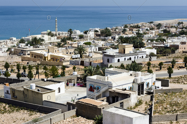 The homes and community compounds of Tiwi Town along the coast of the Gulf of Oman