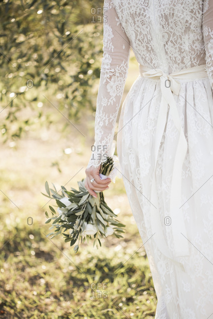 A bride walking in the Italian countryside