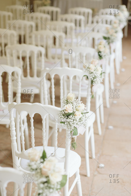 Chairs, flowers set up for wedding