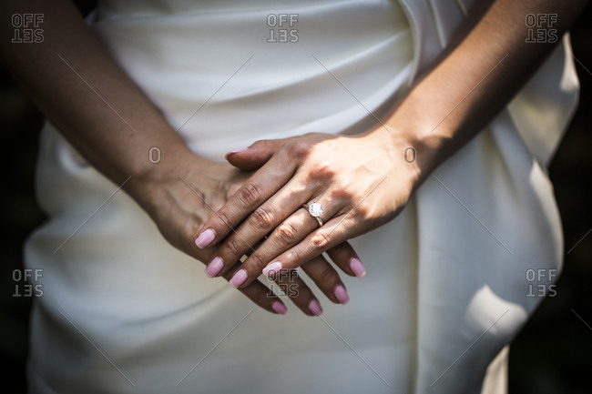 A young Asian bride shows off her wedding ring