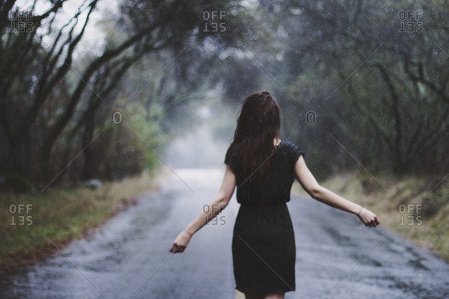 girl walking in rain