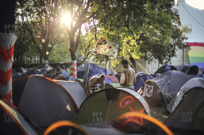Urban campsite at event with rows of tents