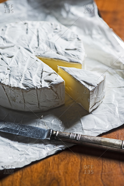 Brie cheese wheel and knife