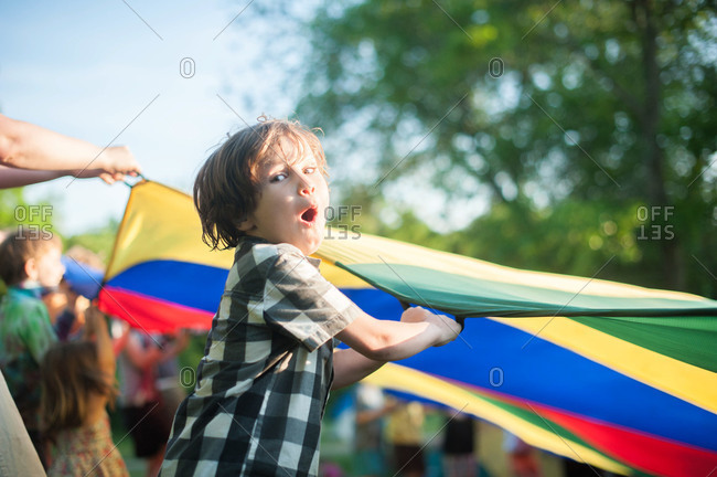 Boy playing a parachute game