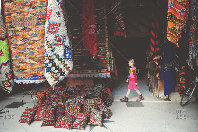 Young girl walking at a Moroccan souk