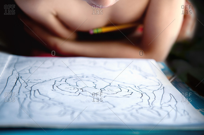 Child working on a dot-to-dot workbook