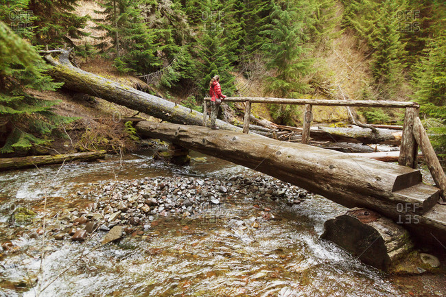 A hiker at Diamond Creek Falls, Oregon