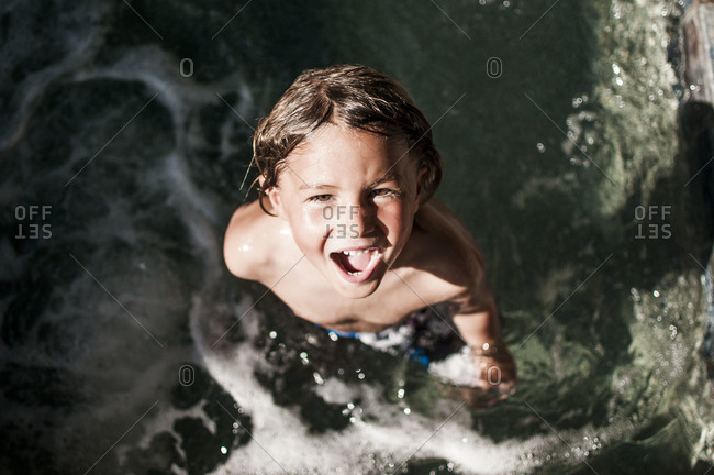 Laughing boy in a hot tub