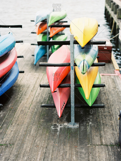Canoes put up on rack in harbor