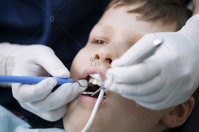Close-up of boy being examined by dentist