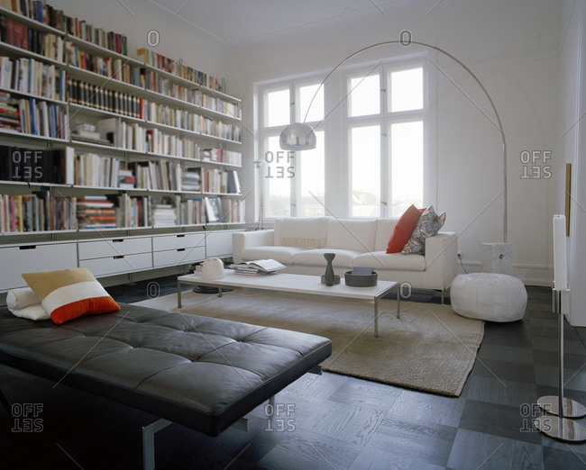 A living room with a large bookshelf, Sweden