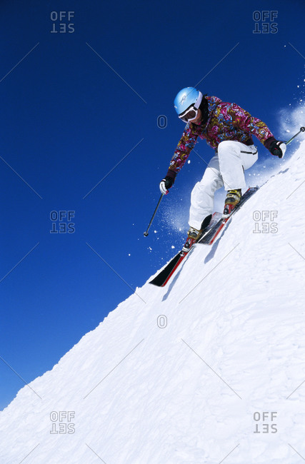 A woman skiing downhill in Jamtland, Sweden