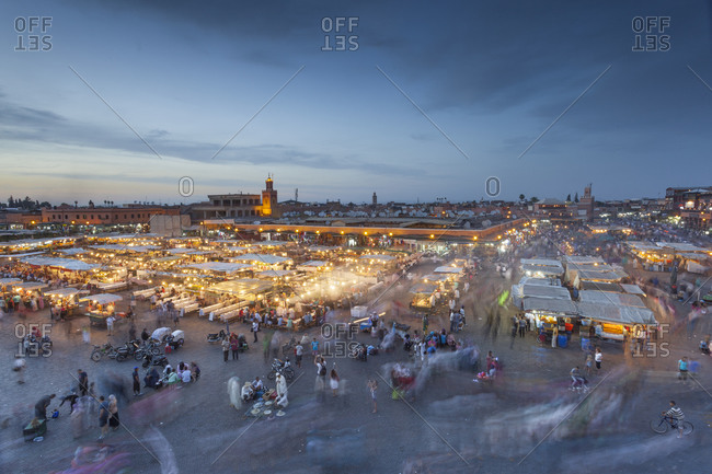 Crowds and food stalls in Jemaa al Fna square at sunset Marrakesh, Morocco