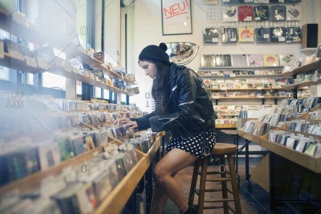 Woman browsing in record store