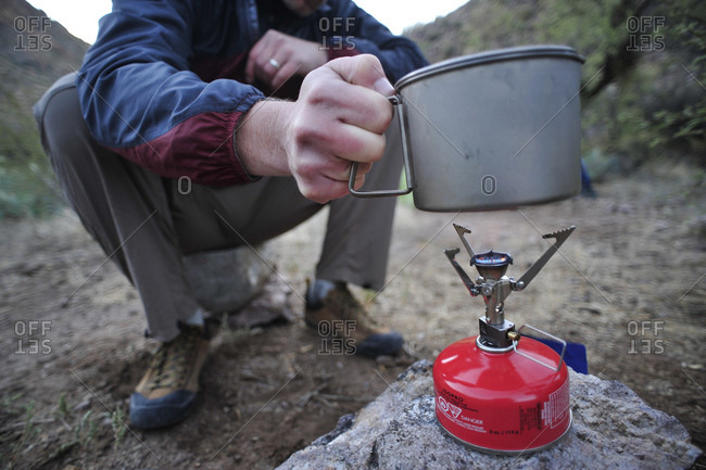 Backpackers prepare dinner with a camp stove by Charleboise Springs in La Barge Canyon on the Dutchmans Trail in the Superstition Wilderness Area, Tonto National Forest