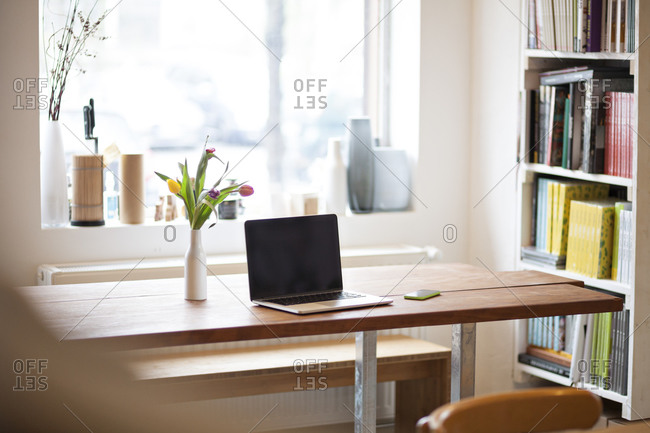 Table with laptop in a modern individual bistro