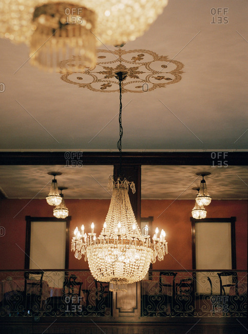 Ornate crystal chandelier and balcony in a dining room