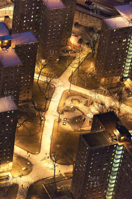 Park between residential buildings in New York City at night
