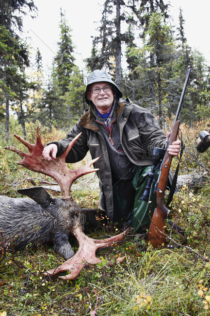 Hunter with killed elk