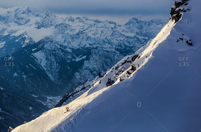 Man skiing on a steep mountain slope in Austria
