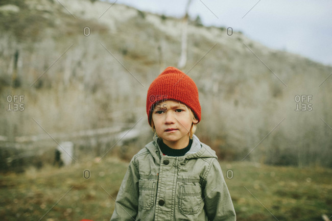 Boy in hat in remote mountain setting