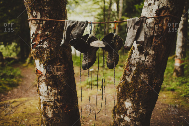 Hiker\'s wet boots and socks hanging up to dry