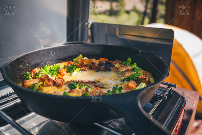 Egg scramble being cooked at campsite