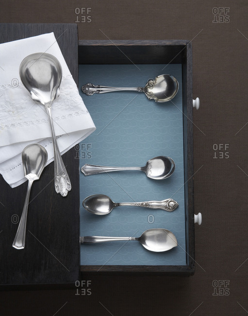 A variety of silver serving spoons