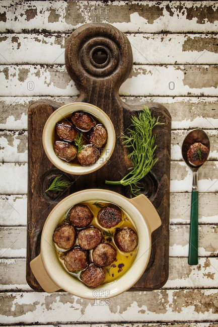 Meatballs and dill served in broth