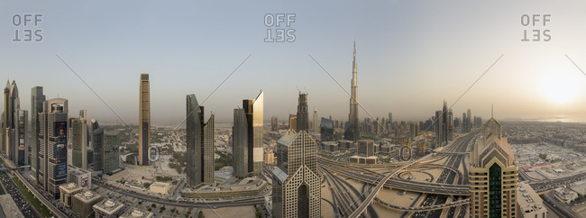 Interchange at Sheikh Zayed Road and Dubai skyline at sunset