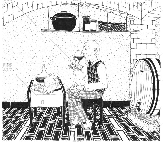 Man drinking in a wine cellar