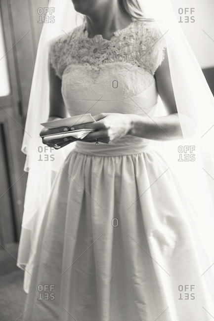 Bride holding cards in her hand