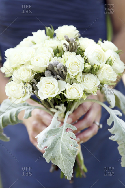 Bridesmaid holding a flower bouquet