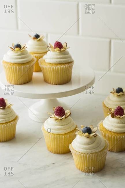 Vanilla bean cupcakes with almond and berries
