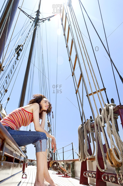 Brunette young woman on a sailing ship