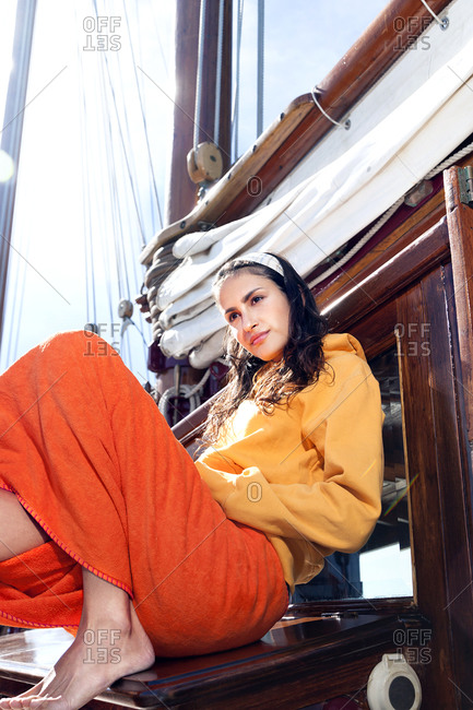 Young woman relaxing on a sailing ship
