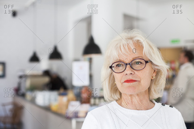 Portrait of older woman in restaurant