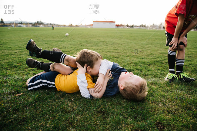 Boys wrestling during soccer practice