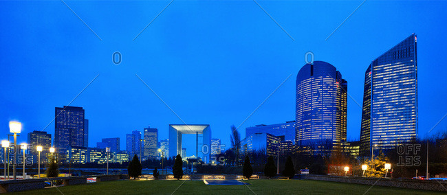 Modern buildings at night in the area of La Defense in the city of Paris, France