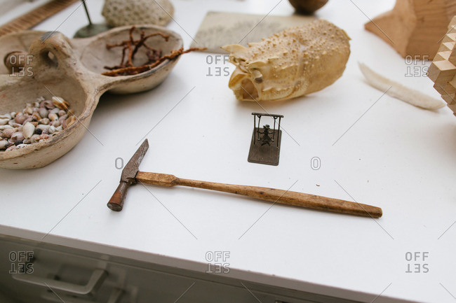 An antique hammer on a dresser