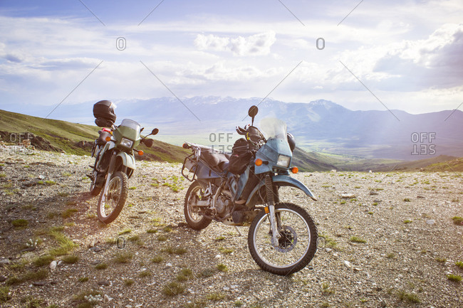 Motorcycles parked in a majestic landscape