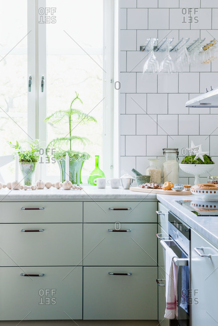 A white kitchen decorated for Christmas in Sweden