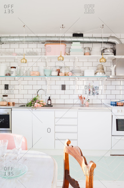 A white kitchen with pastel accents in Sweden