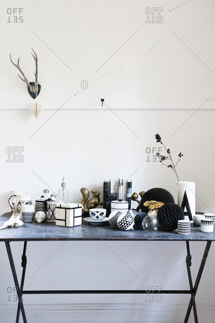 A table covered in black and white knick knacks