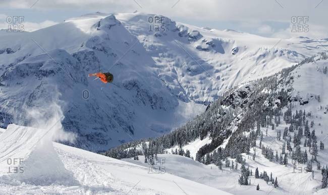 A skier flies off a jump in Whistler, Canada