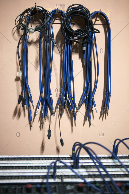 Audio cables on the wall of a recording studio