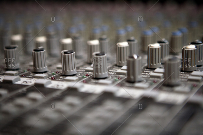 Dials on a mixing board at a recording studio