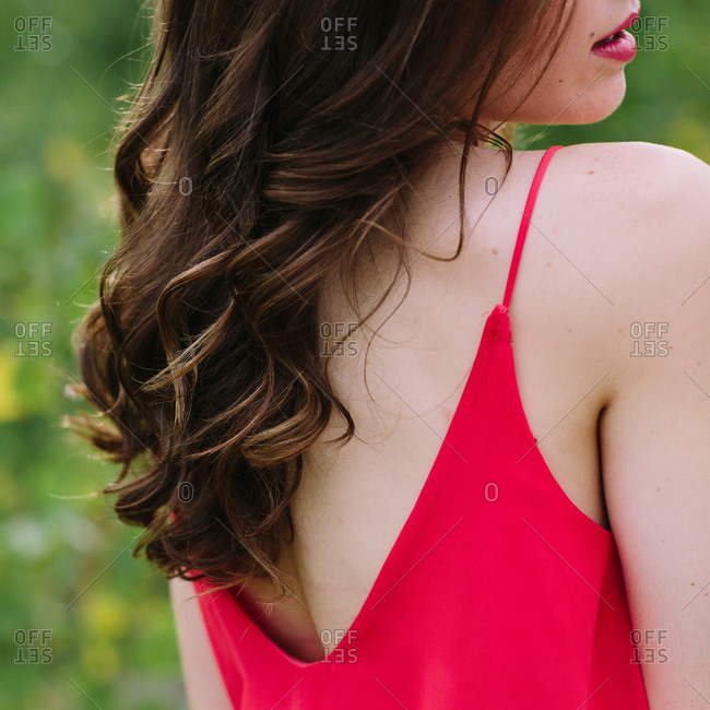Close-up of woman\'s hair curling down her back