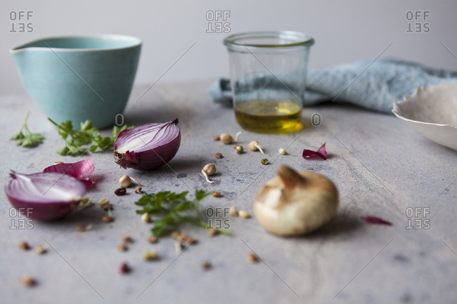 Fresh onions and beans with olive oil, ceramic bowl and dish cloth