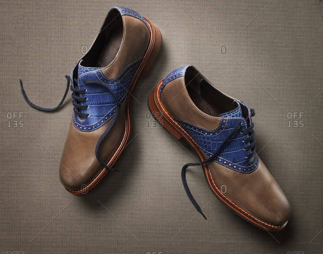 Men\'s brown and blue saddle-style oxford shoes